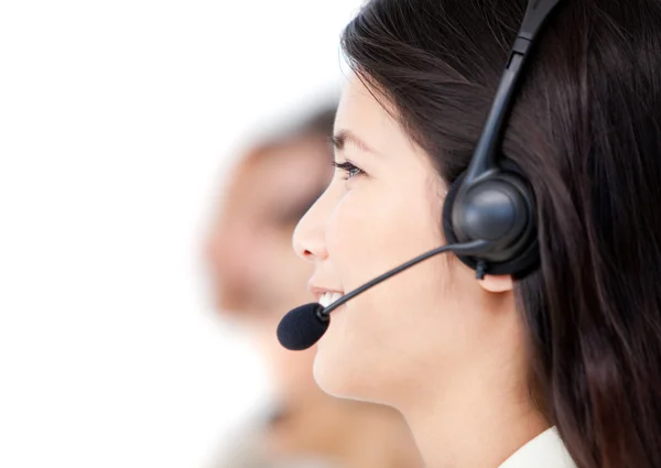 Close-up of business with headset on standing against a w — Stock Photo, Image