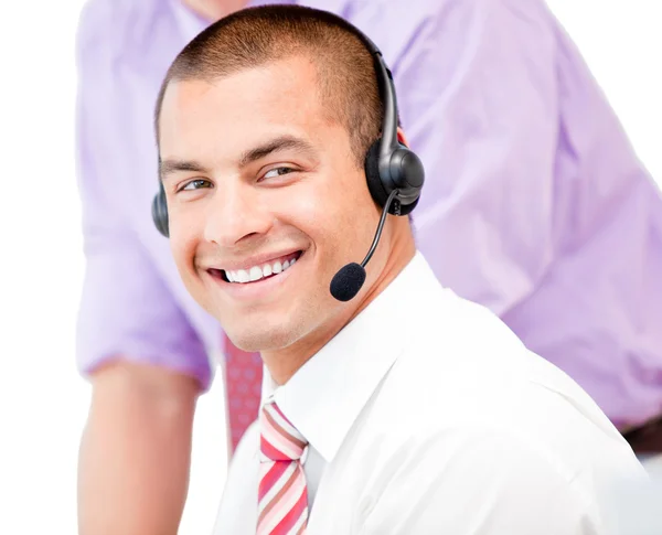 Portrait of a smiling businessman with headset on — Stock Photo, Image