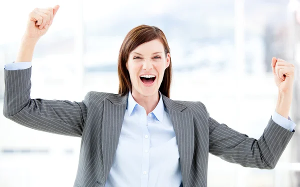 Positive businesswoman punching the air — Stock Photo, Image