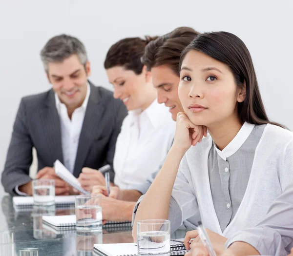 Young businesswoman bored at a presentation — Stock Photo, Image