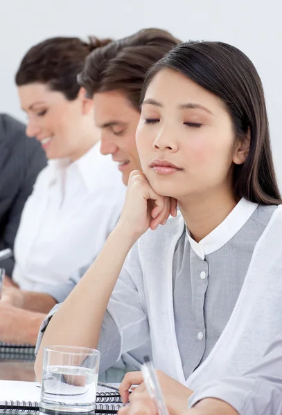 Bored businesswoman in a meeting — Stock Photo, Image