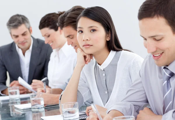 Bored asian businesswoman in a meeting — Stock Photo, Image