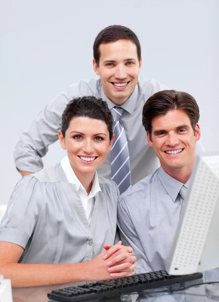 Fortunate businessteam working at a computer — Stock Photo, Image