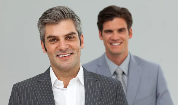 Счастливые бизнесмены в очереди — стоковое фото