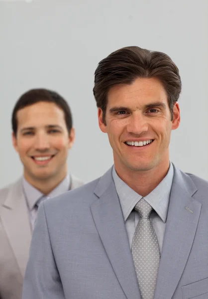 Confident business associates in a row — Stock Photo, Image