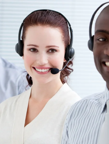 Self-assured customer service representatives standing in a line — Stock Photo, Image