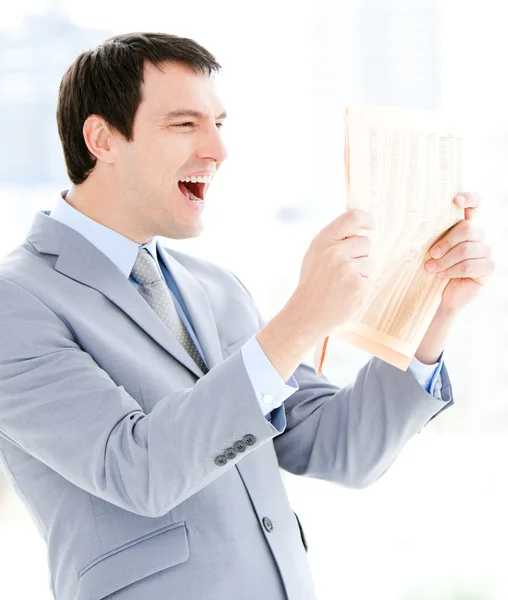 Portrait of a positive businessman reading a newspaper — Stock Photo, Image
