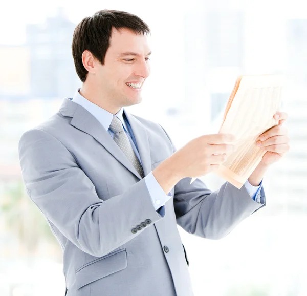Portrait of a relaxed businessman reading a newspaper — Stock Photo, Image