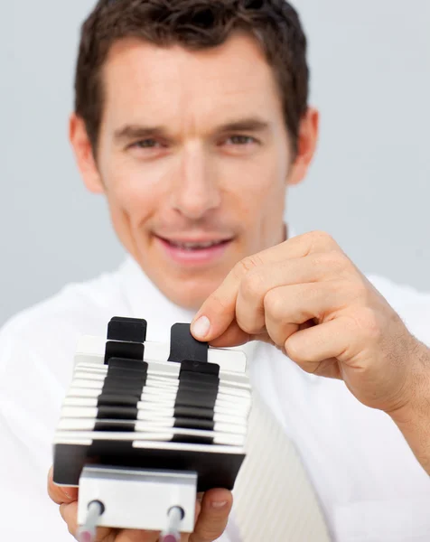 Attractive businessman holding a card holder — Stock Photo, Image