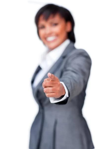 Smiling hispanic businesswoman pointing — Stock Photo, Image