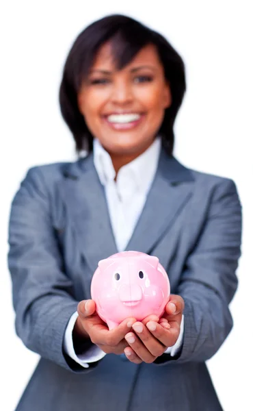 Hispanic Businesswoman holding a piggybank — Stock Photo, Image