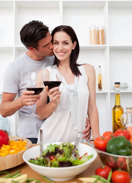Lovers toasting with wine and cooking — Stock Photo, Image