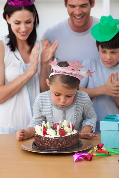 Portrait of a little girl blow out candles — Stock Photo, Image