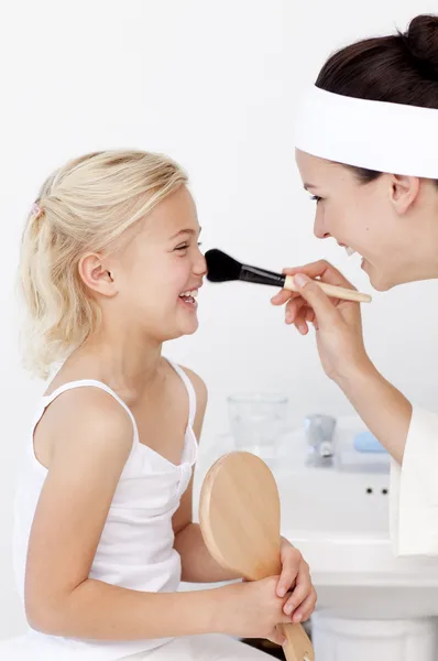 Daughter and mother putting makeup — Stock Photo, Image