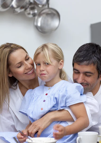 Daughter disliking food with her parents — Stock Photo, Image