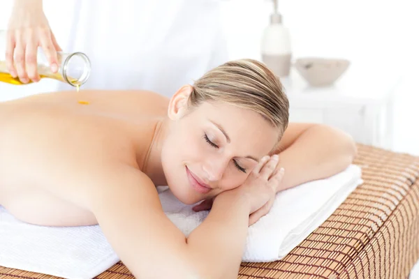 Relaxed woman receiving a back massage — Stock Photo, Image