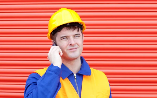 Happy male engineer talking on the phone — Stock Photo, Image