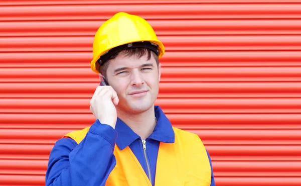 Serious male engineer talking on the phone — Stock Photo, Image
