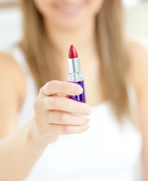 Close-up of woman holding a lipstick — Stock Photo, Image