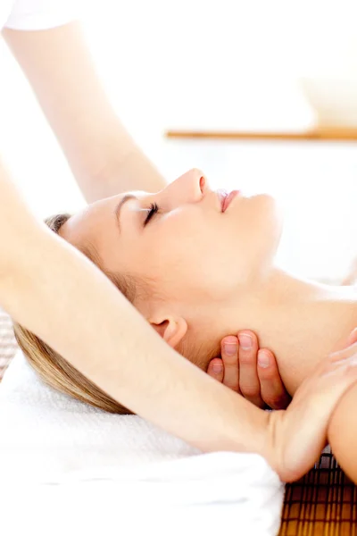 Portrait of a young woman having a massage — Stock Photo, Image