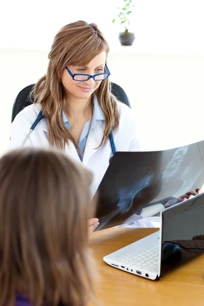 Delighted female doctor studying radiography — Stock Photo, Image