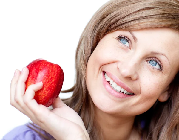 Radiant woman holding an apple — Stock Photo, Image