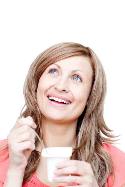 Cheerful woman eating a yogurt — Stock Photo, Image