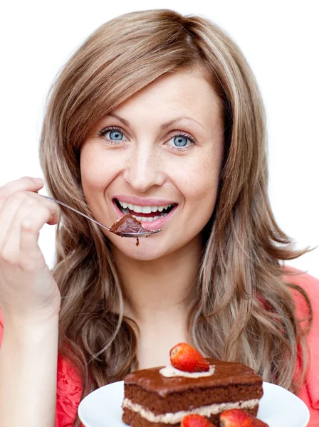 Charming woman eating a cake — Stock Photo, Image