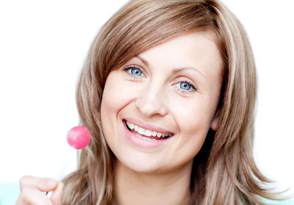 Smiling woman holding a lollipop — Stock Photo, Image