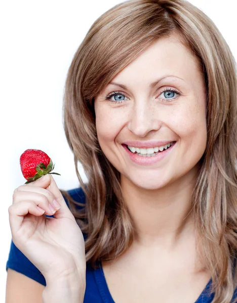 Delighted woman eating strawberries — Stock Photo, Image