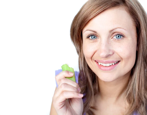 Radiant young woman eating celery — Stock Photo, Image