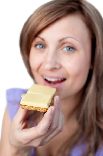 stock image Charming woman eating a cracker with cheese