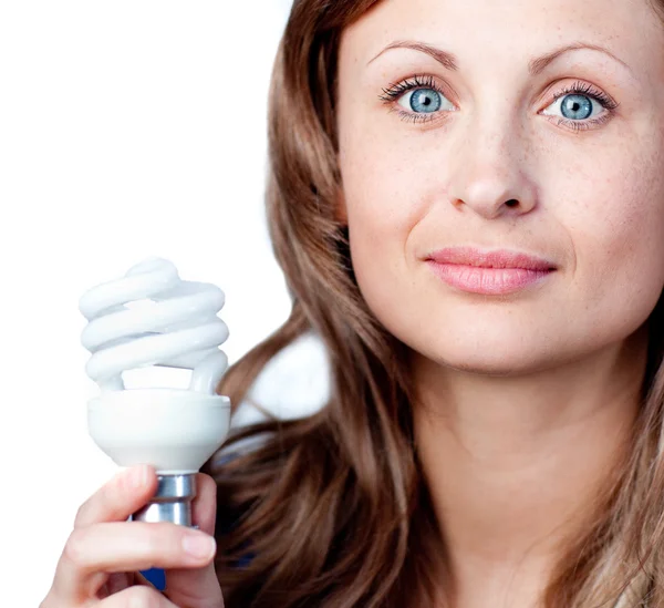 Cute woman is holding a lightbulb — Stock Photo, Image