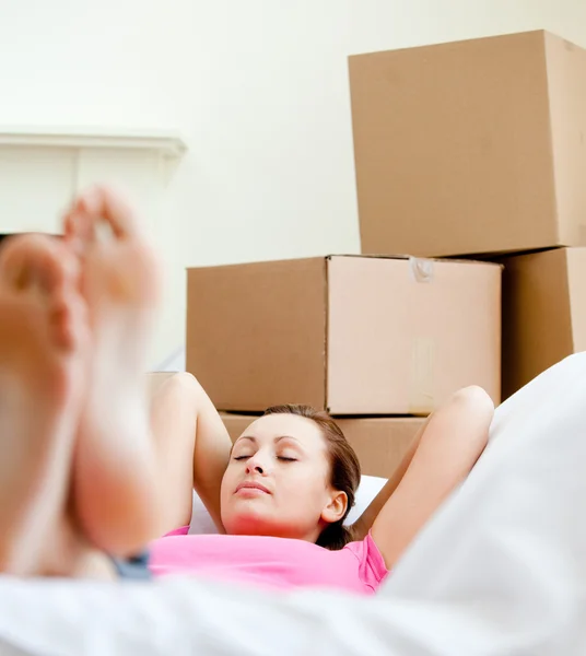 stock image Attractive woman having a break between boxes