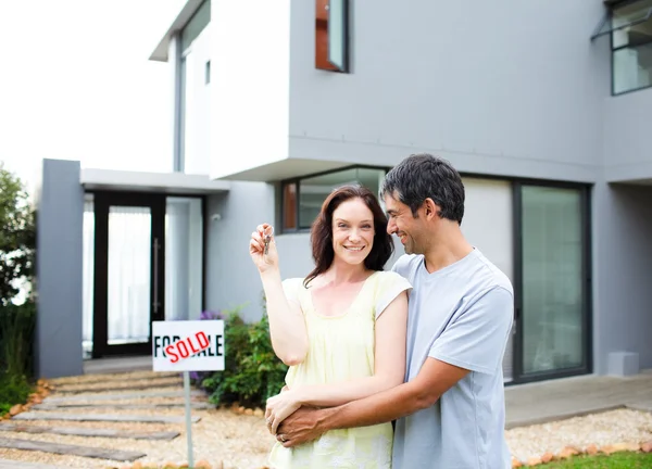 Happy couple after buying house Stock Image