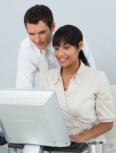 Businessman and Afro-American businesswoman in the office Stock Image