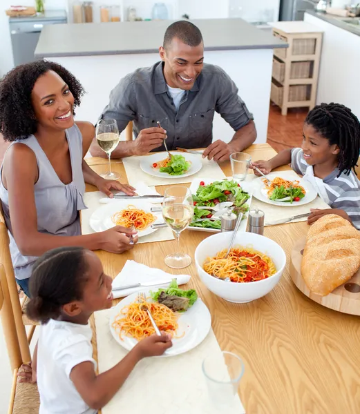 Happy family dining together — Stock Photo, Image
