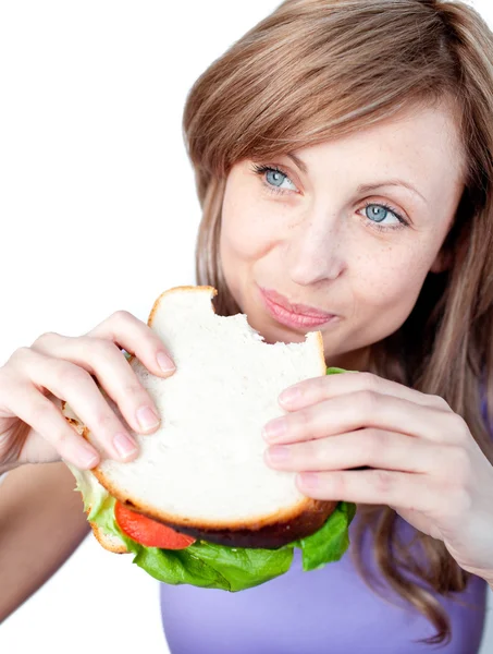 Веселая женщина ест сэндвич Лицензионные Стоковые Изображения