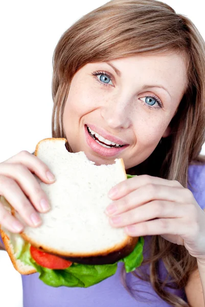 幸せな女性がサンドイッチを食べて ロイヤリティフリーのストック写真