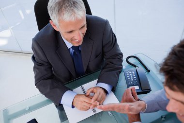 Above view of a businessman during a meeting clipart