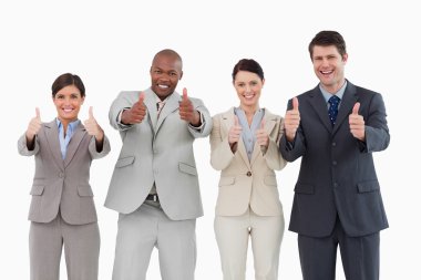 Smiling salesteam giving thumbs up clipart