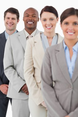 Confident smiling salesteam standing together clipart