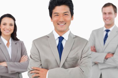 Smiling salesteam with arms crossed clipart