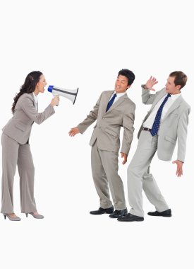 Saleswoman with megaphone yelling at colleagues clipart