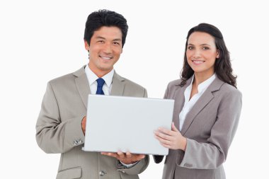 Smiling salesteam with laptop clipart