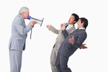 Senior salesman with megaphone yelling at his employees clipart