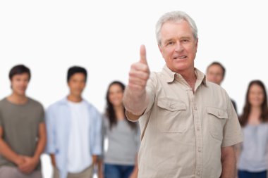 Mature man giving thumb up with young behind him clipart