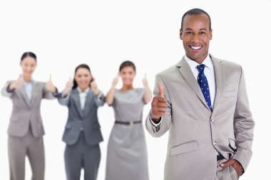 Happy businessman with a hand in his pocket approving with co-wo clipart