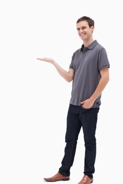 Standing man smiling and presenting clipart