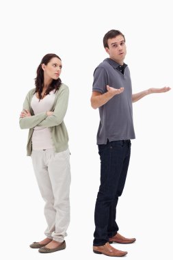 Man shrugged his shoulders back to back with angry woman clipart